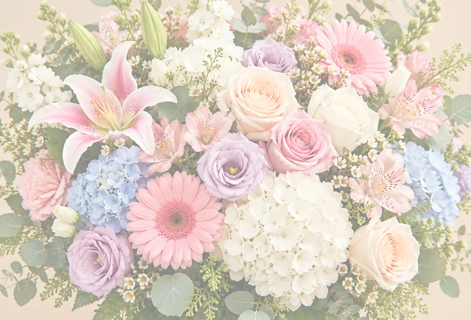 Colorful bouquet of pink, white, lavender, and blue flowers with lush greenery.
